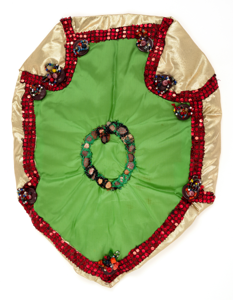 Elizabeth Talford Scott, “Rock Circle 2” (1993), fabric, rocks, buttons, beads, thread, 21.5 x 16 inches